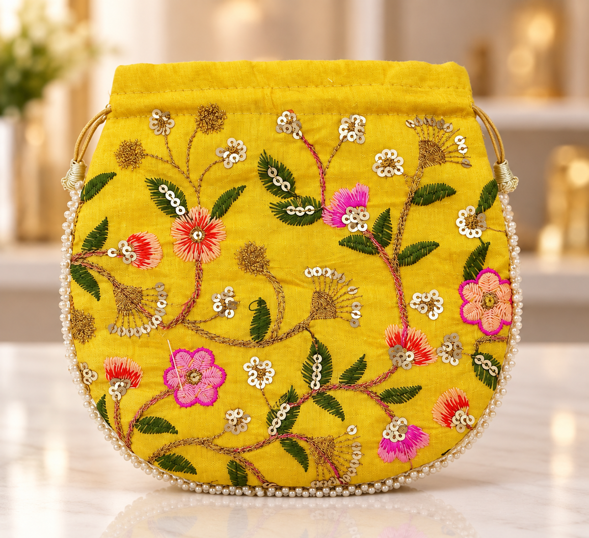 Yellow Floral Embroidered Potli Bag with Pearl Border
